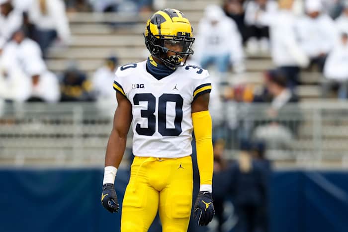 Michigan safety Daxton Hill warming up